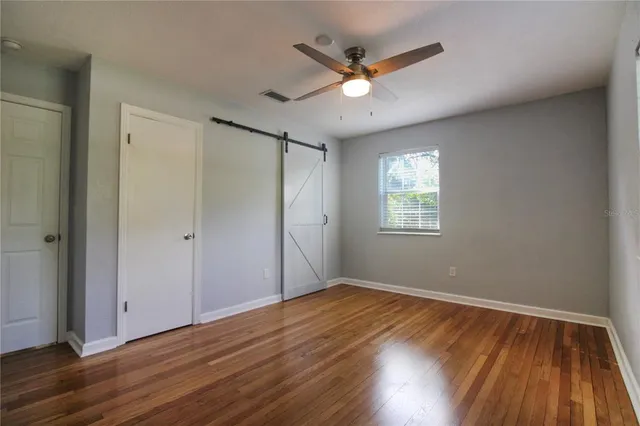 a bathroom with a sink a light fixture and a mirror