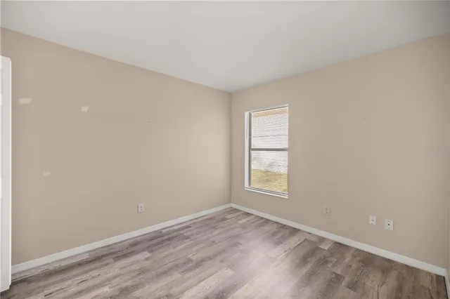 a view of a livingroom with furniture and a flat screen tv
