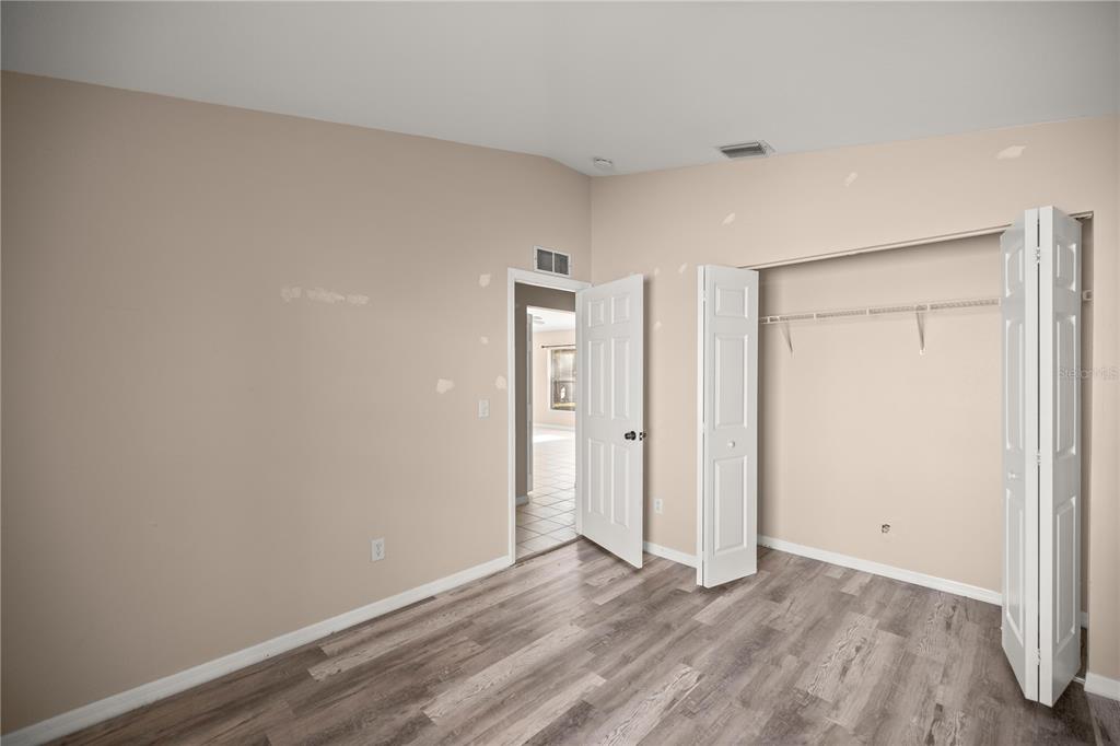 9680 Southwest 30th Terrace Ocala, FL 34476 - Photo 7 of 27 a view of an empty room and wooden floor