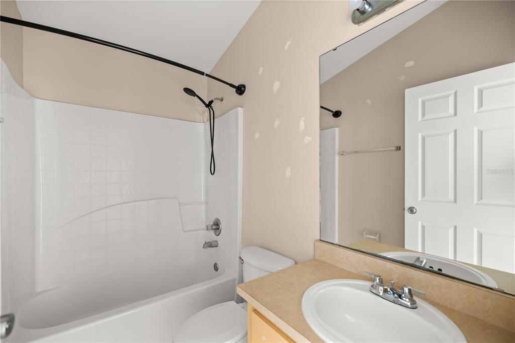 9680 Southwest 30th Terrace Ocala, FL 34476 - Photo 8 of 27 a bathroom with a sink and a bathtub