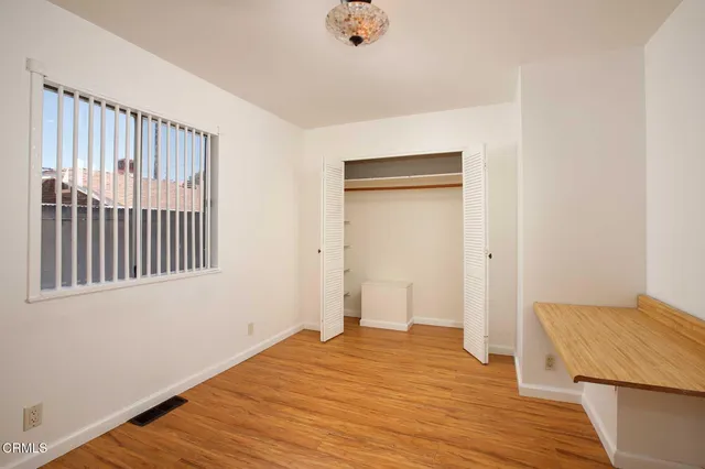 a view of a livingroom with wooden floor