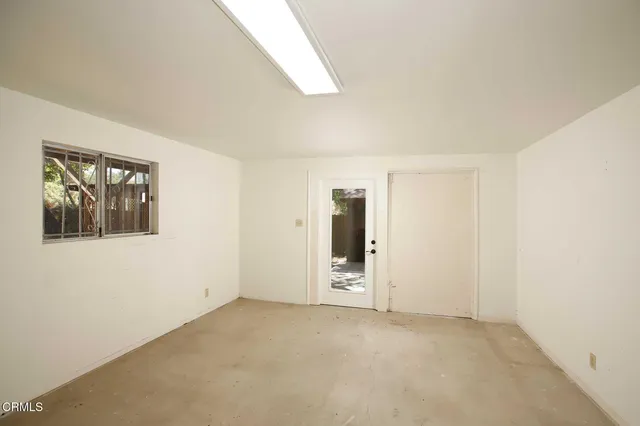 an empty room with windows