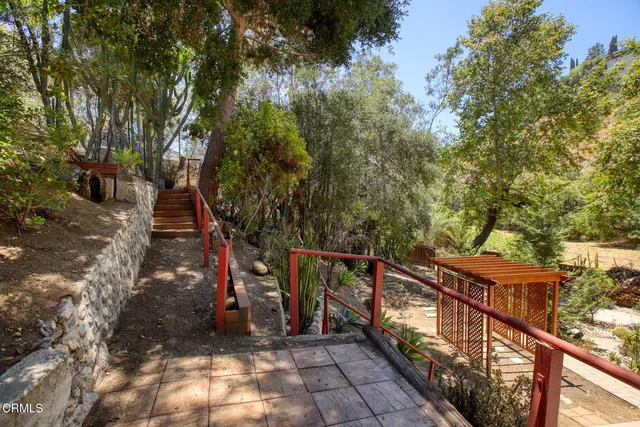 a view of a fountain of the house with a yard
