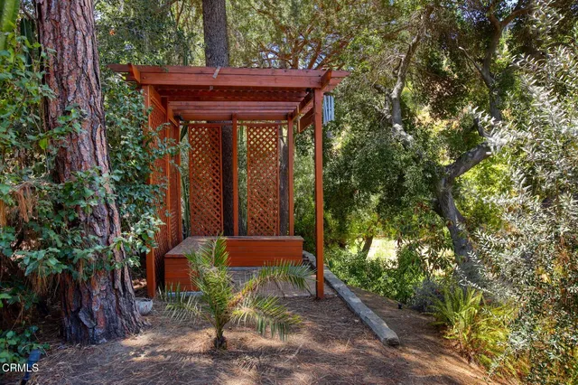 a view of a house with a tree