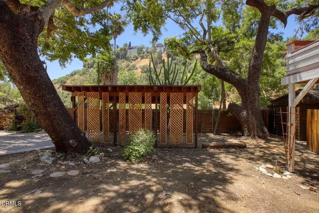 a view of a patio with table and chairs and potted plants