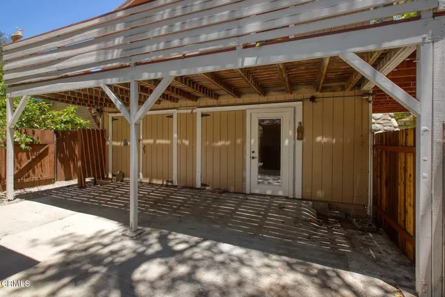 a view of a wooden deck with a tree