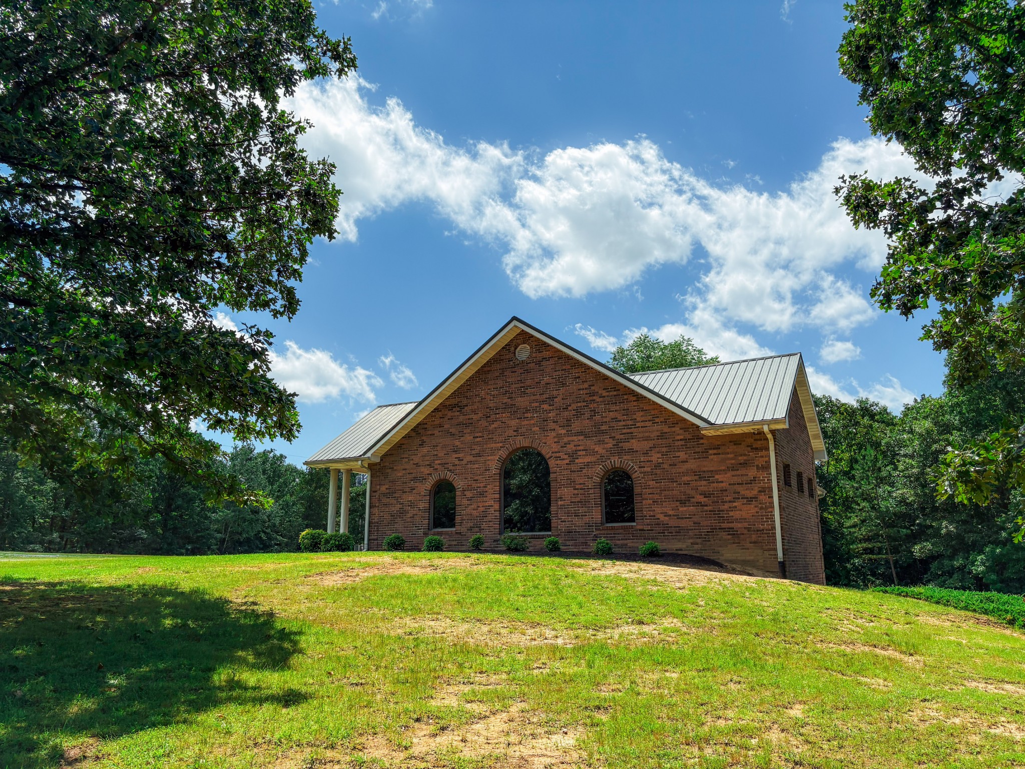 110 Hankins Road Hohenwald, TN 38462 - Photo 1 of 27 a front view of house with yard and trees