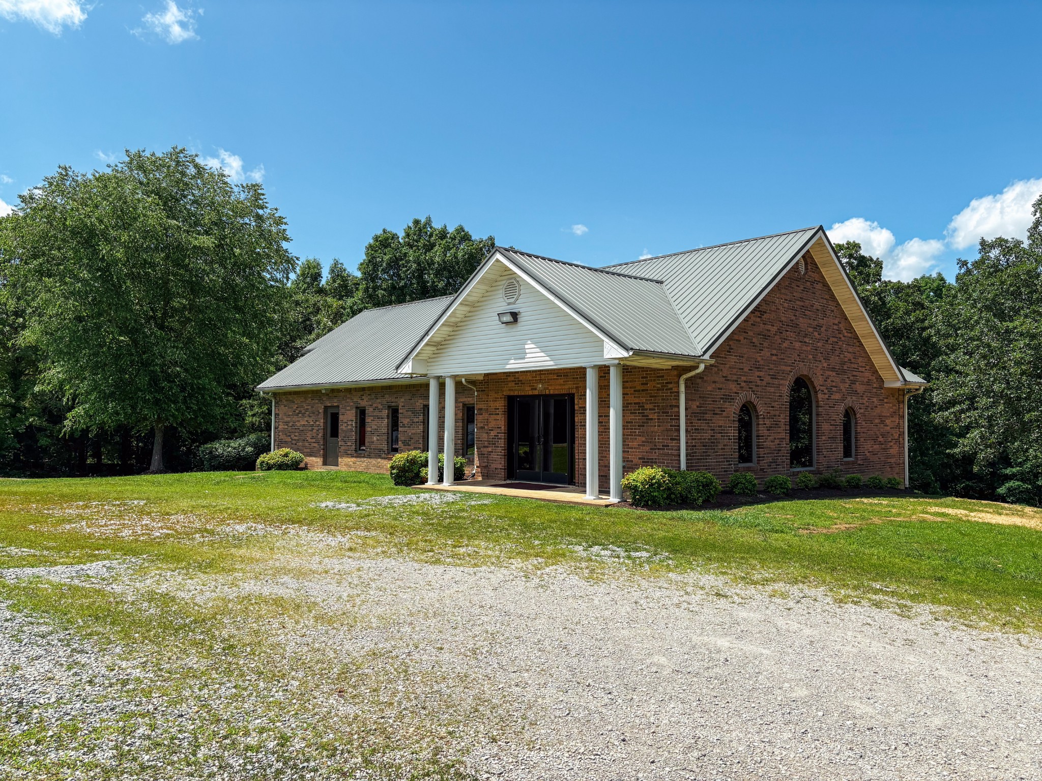 110 Hankins Road Hohenwald, TN 38462 - Photo 24 of 27 a front view of a house with a yard and trees