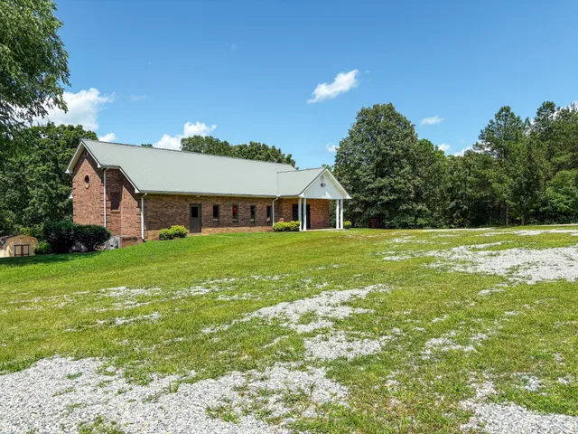 a front view of house with garden