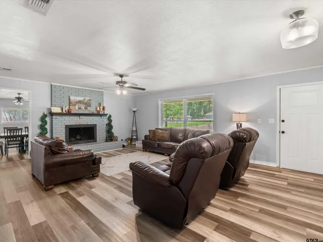 a living room with furniture and a fireplace