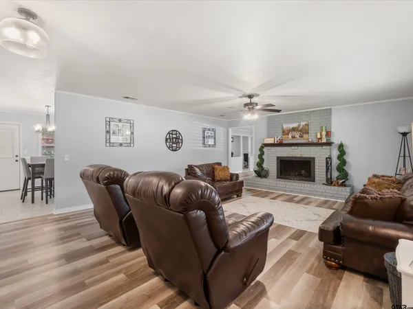 a living room with furniture a fireplace