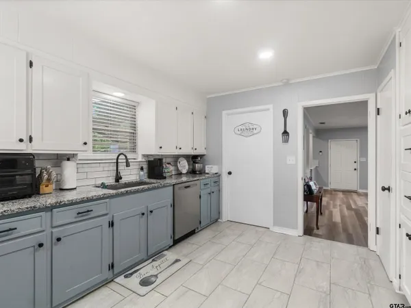 a kitchen with a sink and cabinets