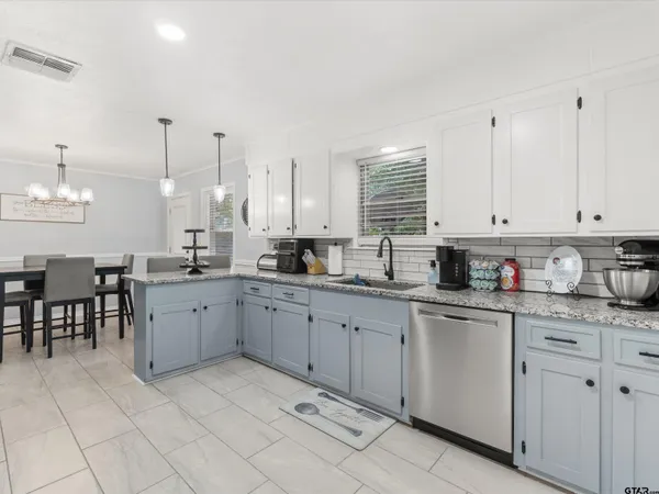 a kitchen with cabinets and sink