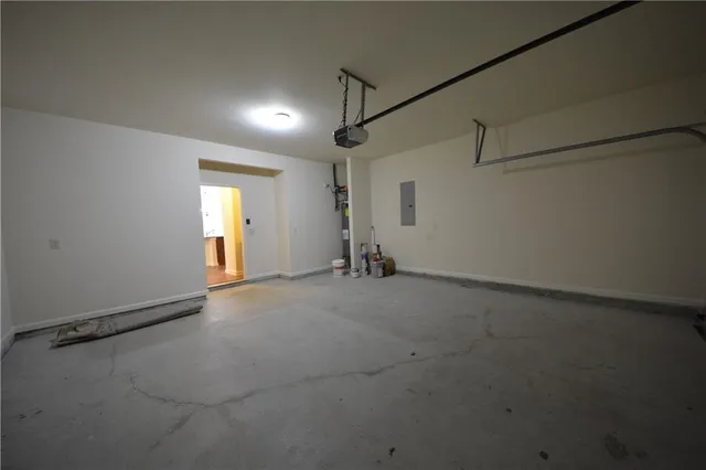 an empty room with a ceiling fan and window