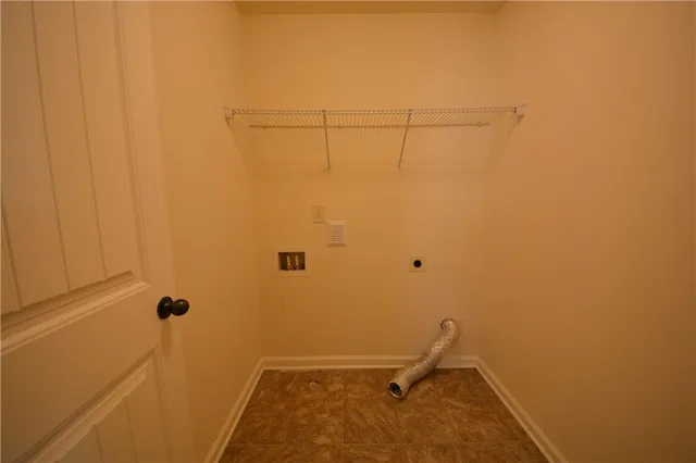 an empty room with a bathroom
