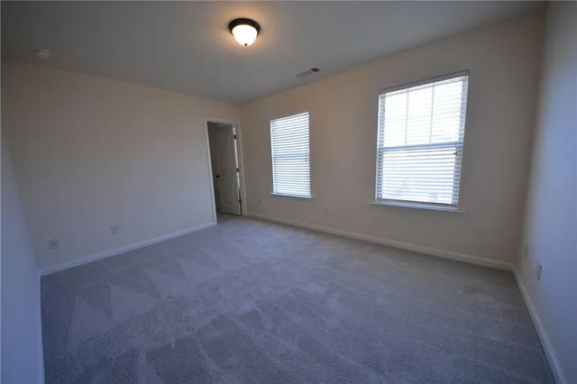 a bathroom with a sink a tub and a mirror