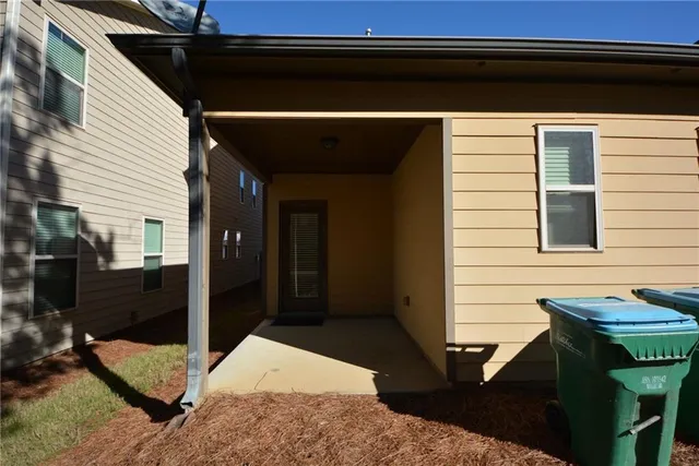 a view of a house with a snow on the road