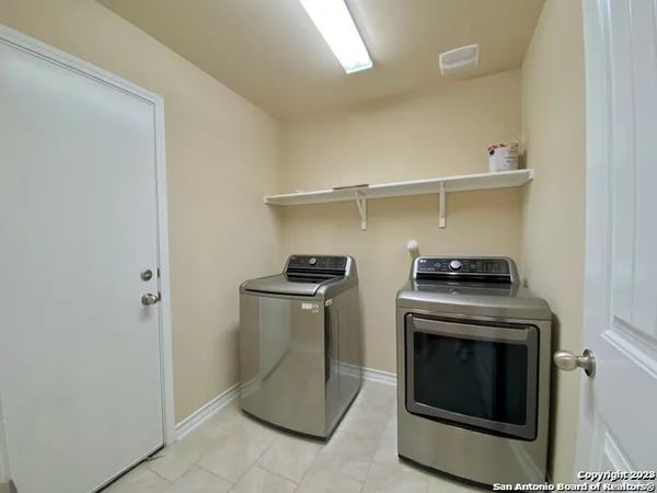a stove top oven sitting inside of a kitchen