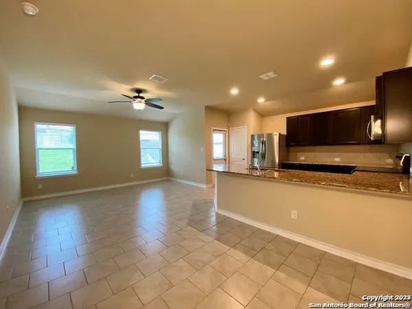 a view of a kitchen with a sink and a microwave