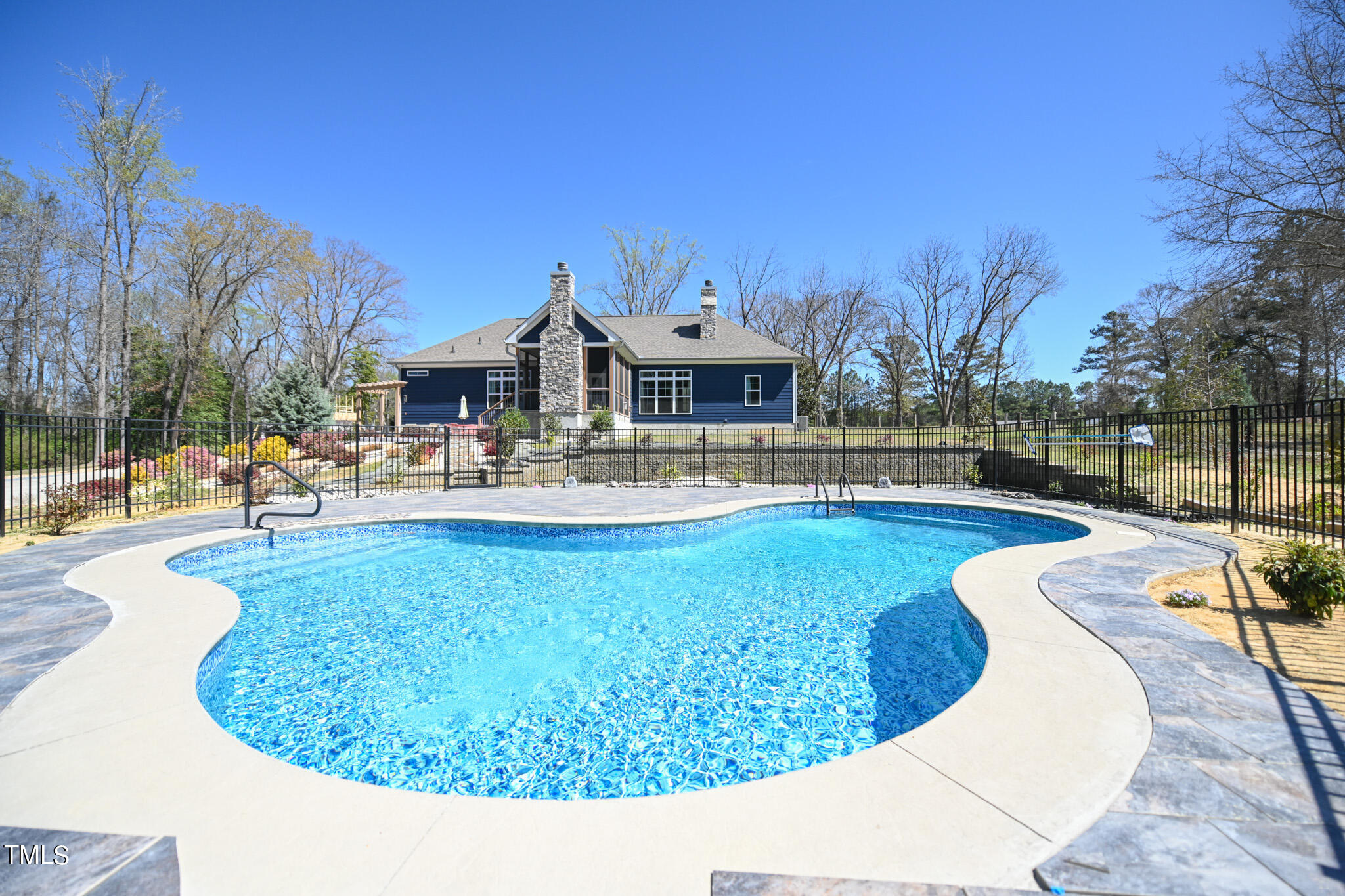 664 Old Fairground Road Willow Spring, NC 27592 - Photo 11 of 40 a view of a house with swimming pool and a yard