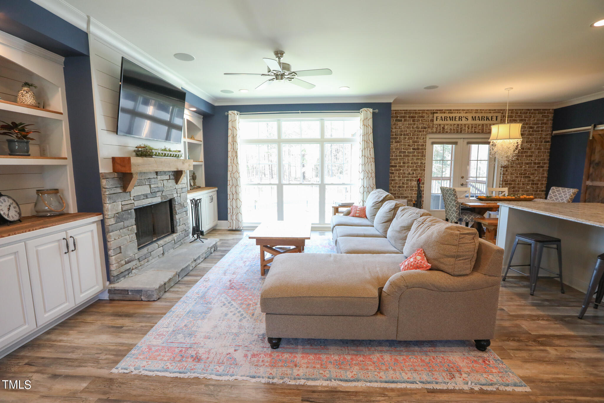 664 Old Fairground Road Willow Spring, NC 27592 - Photo 15 of 40 a living room with furniture fireplace and flat screen tv