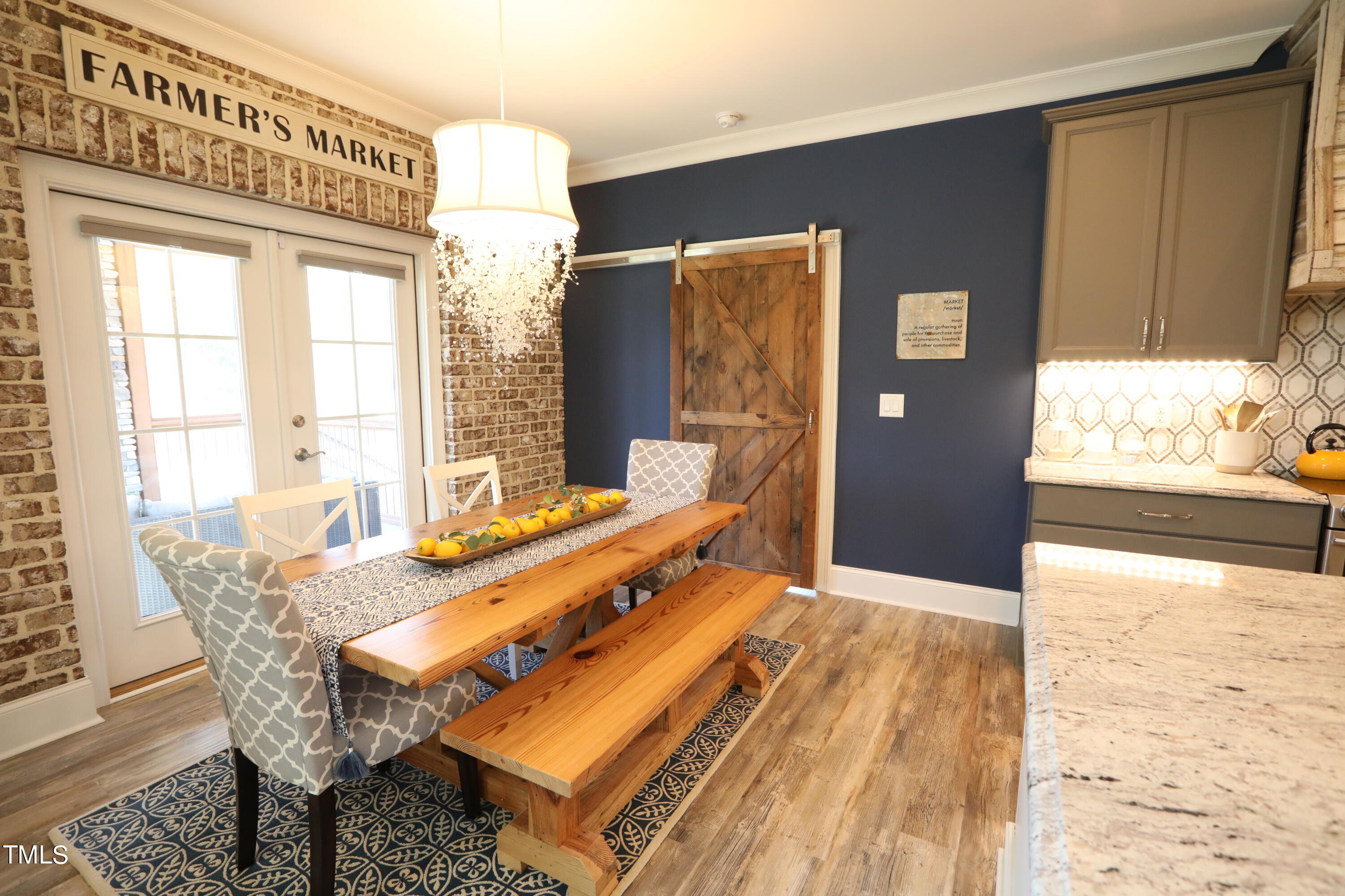 664 Old Fairground Road Willow Spring, NC 27592 - Photo 17 of 40 a bedroom with a bed and wooden floor
