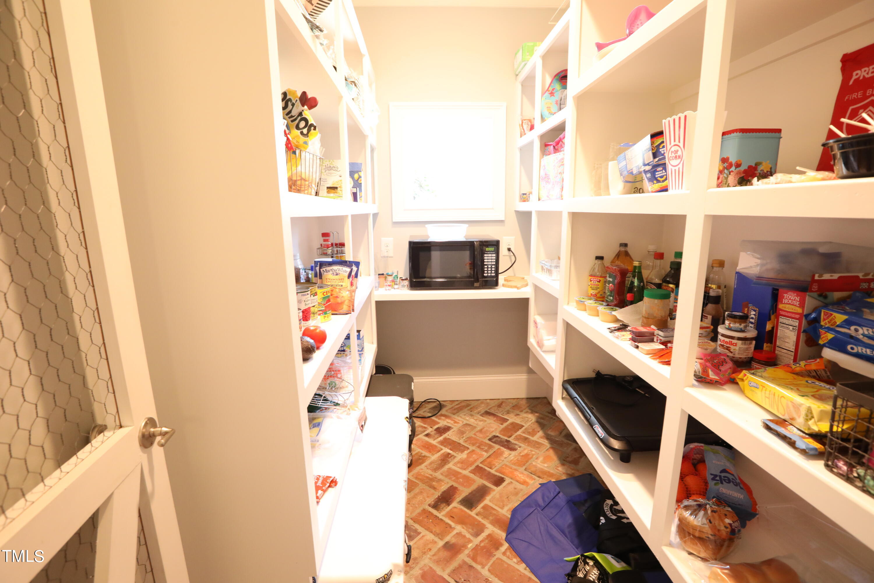 664 Old Fairground Road Willow Spring, NC 27592 - Photo 20 of 40 a kitchen with a stove and a white refrigerator