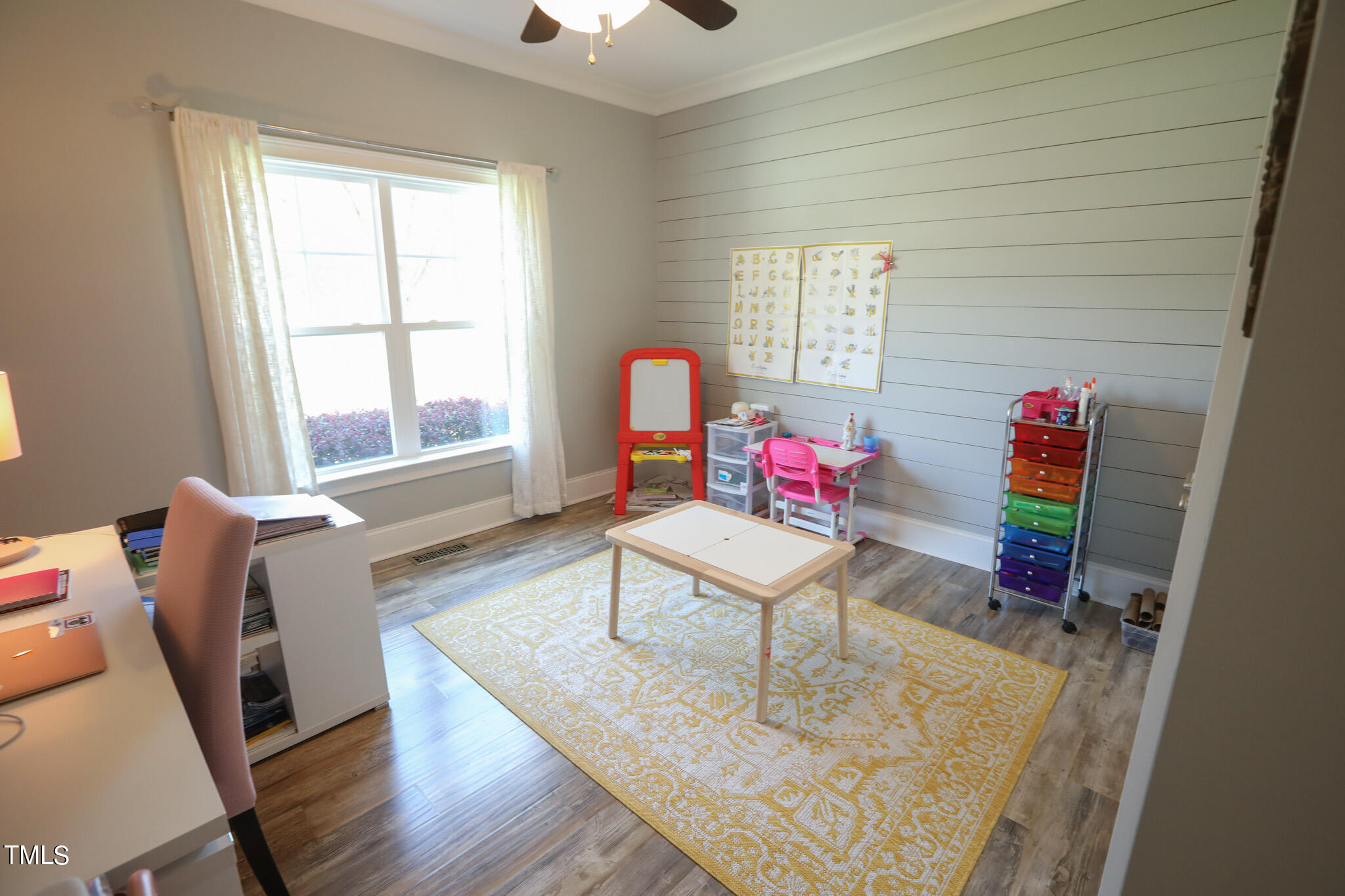 664 Old Fairground Road Willow Spring, NC 27592 - Photo 26 of 40 a living room with furniture and a window