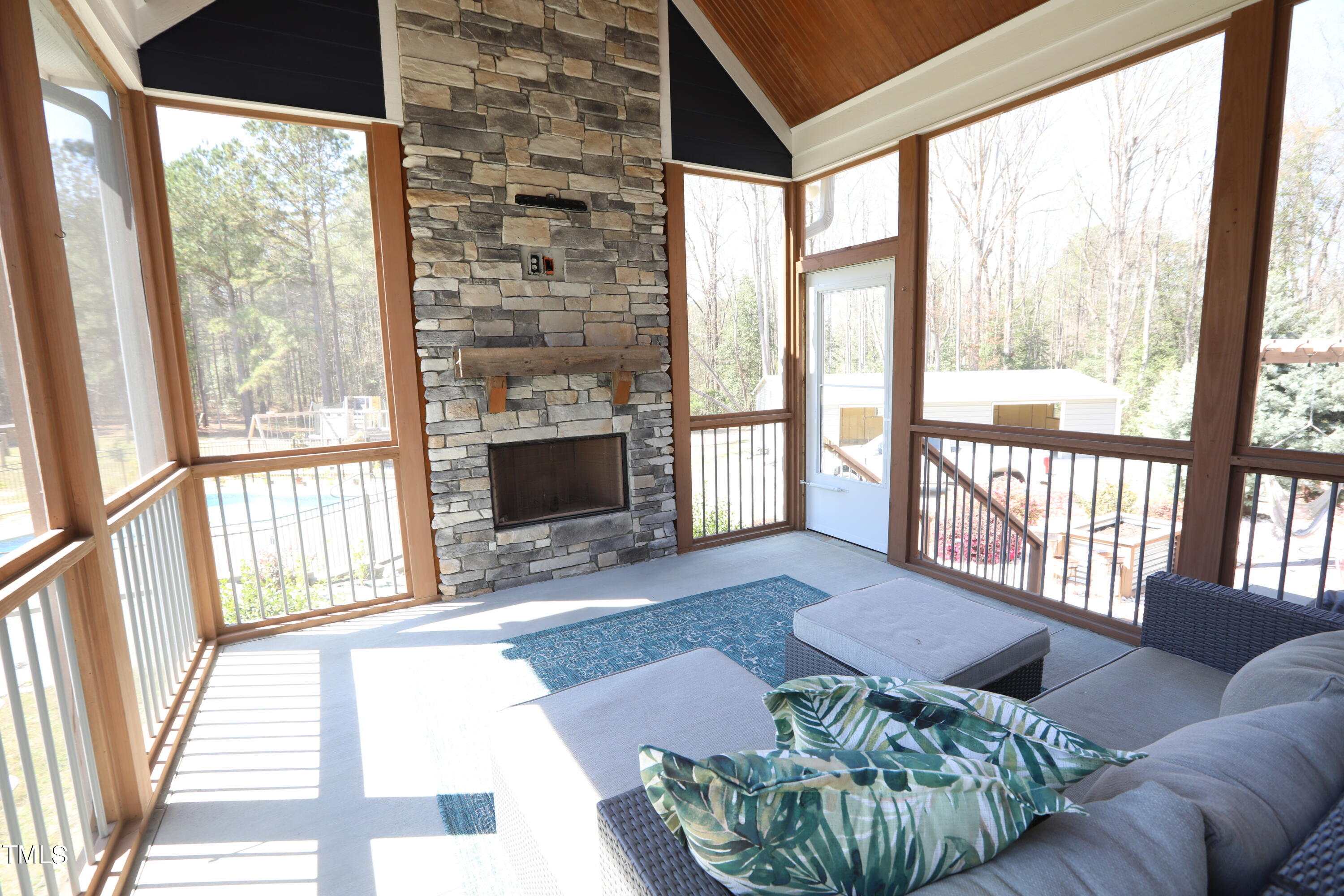 664 Old Fairground Road Willow Spring, NC 27592 - Photo 30 of 40 a living room with furniture and a fireplace