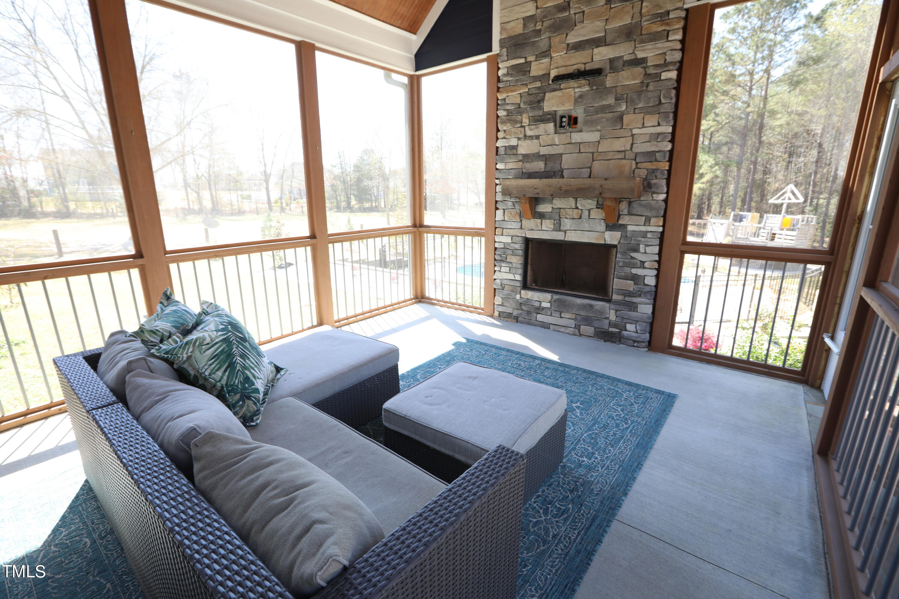 664 Old Fairground Road Willow Spring, NC 27592 - Photo 31 of 40 a living room with furniture and a fireplace
