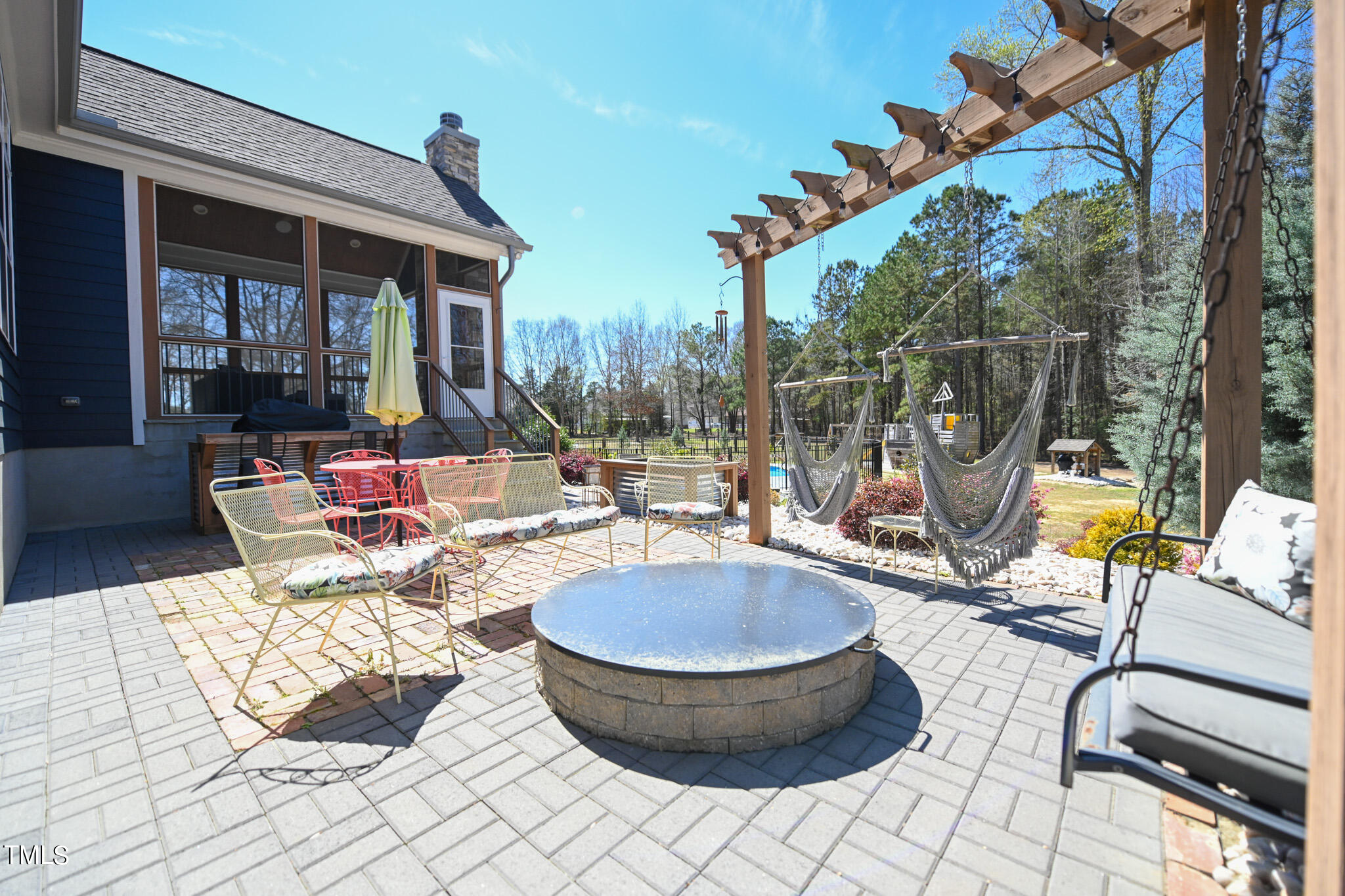 664 Old Fairground Road Willow Spring, NC 27592 - Photo 36 of 40 a building outdoor space with patio furniture and potted plants