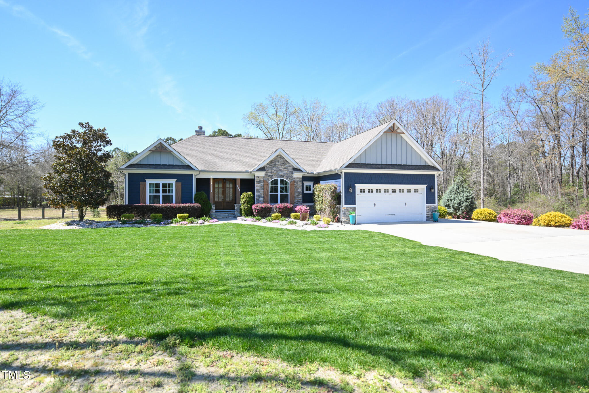 664 Old Fairground Road Willow Spring, NC 27592 - Photo 39 of 40 a front view of a house with a garden