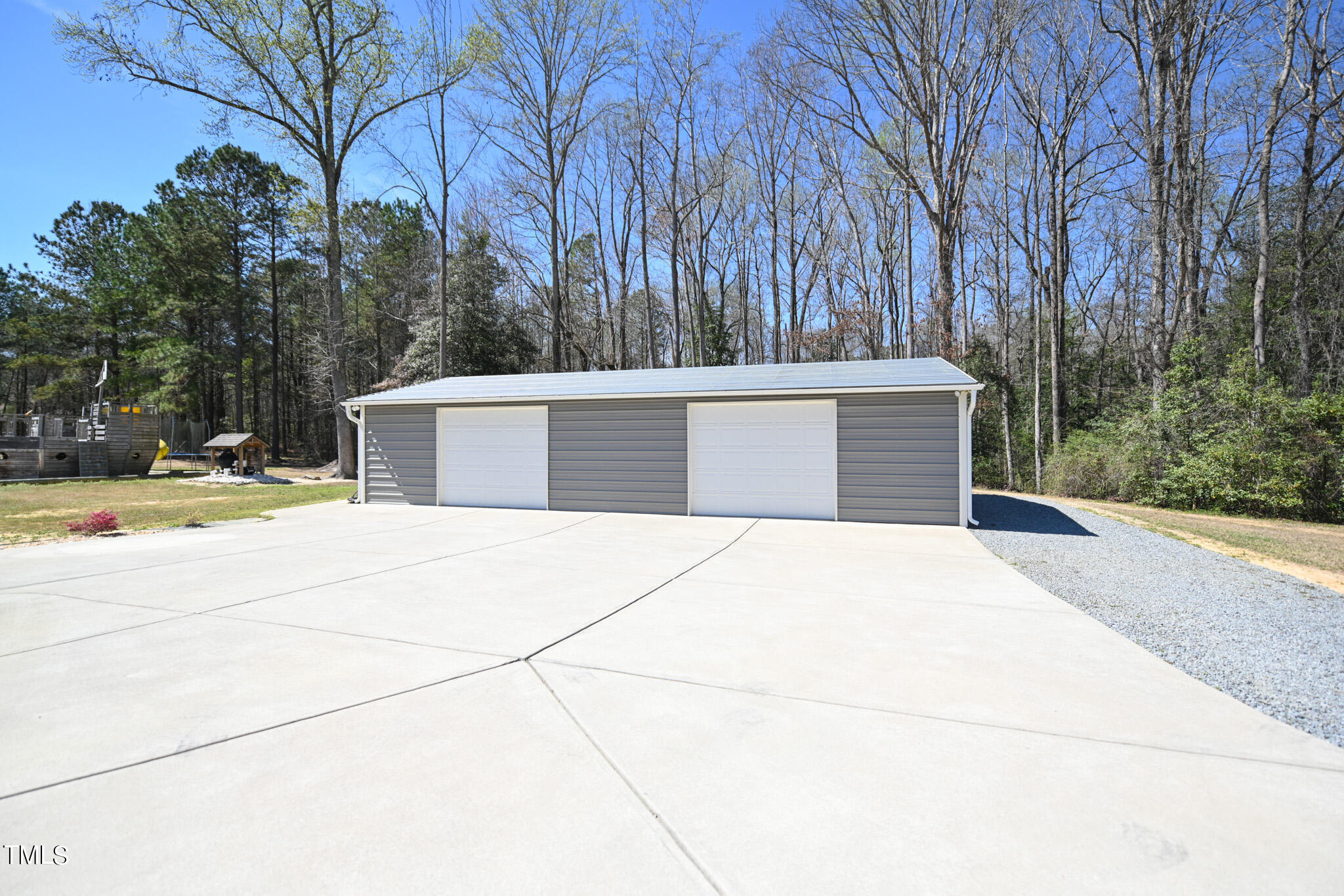 664 Old Fairground Road Willow Spring, NC 27592 - Photo 7 of 40 front view of house with a yard and trees