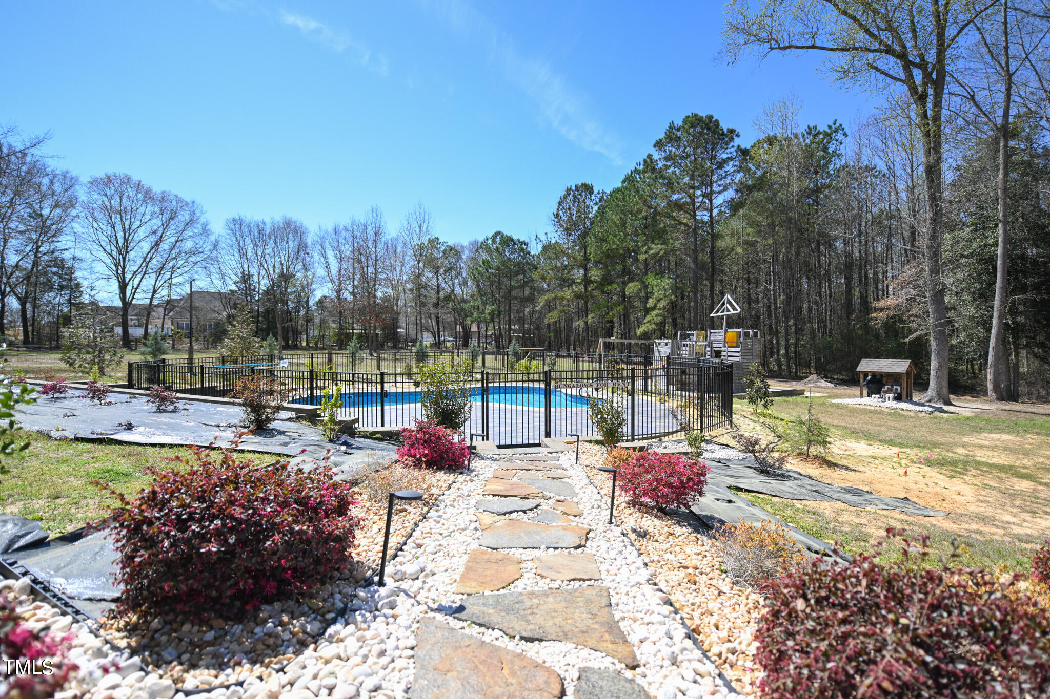 664 Old Fairground Road Willow Spring, NC 27592 - Photo 8 of 40 a view of a swimming pool with a patio