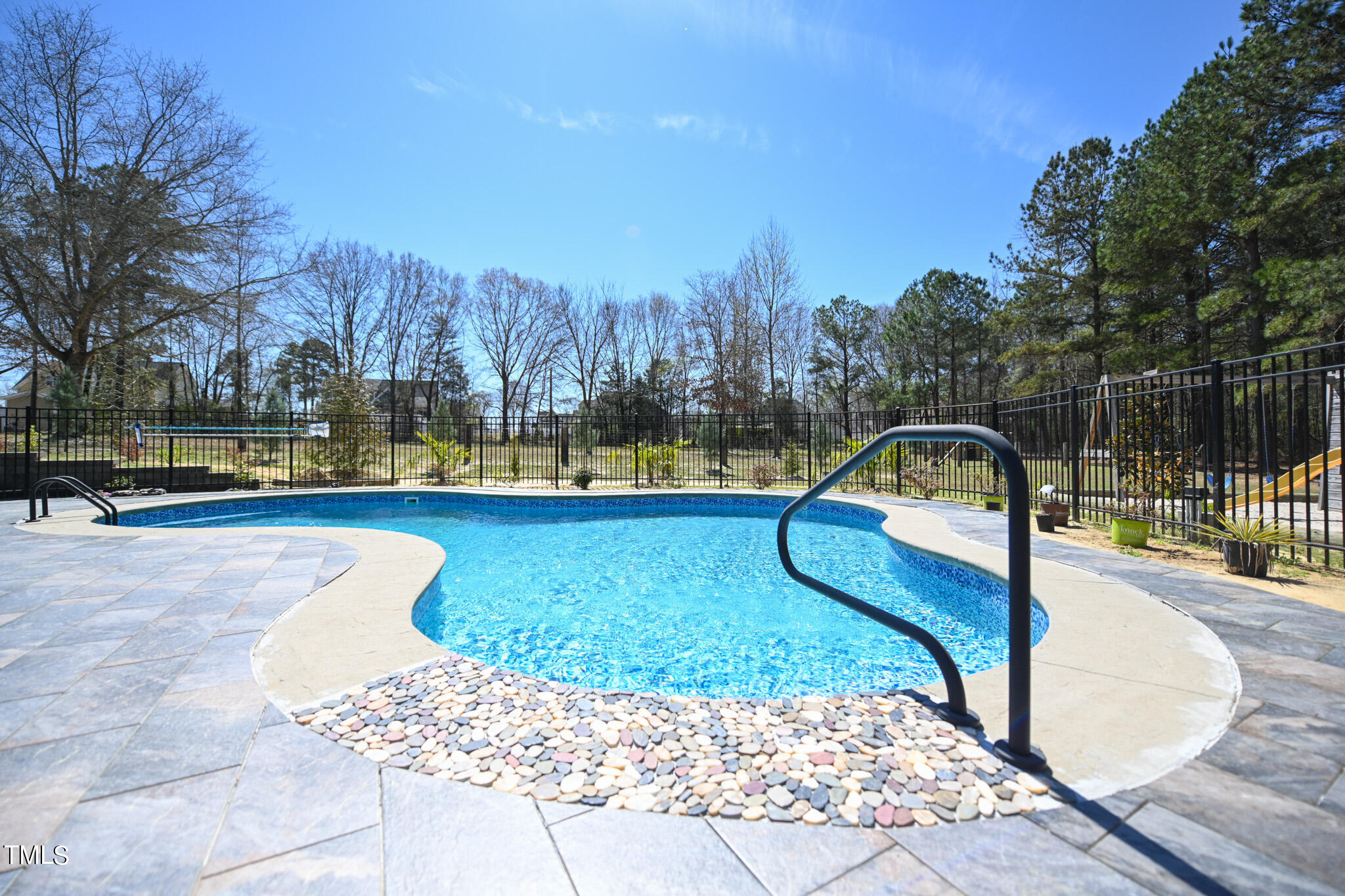 664 Old Fairground Road Willow Spring, NC 27592 - Photo 10 of 40 a view of a swimming pool with a patio