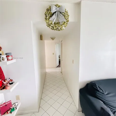 a living room with a couch and a chandelier