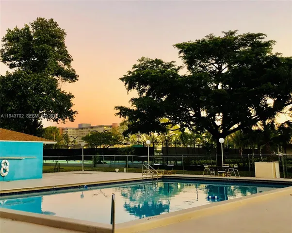 a view of a swimming pool with a lake view