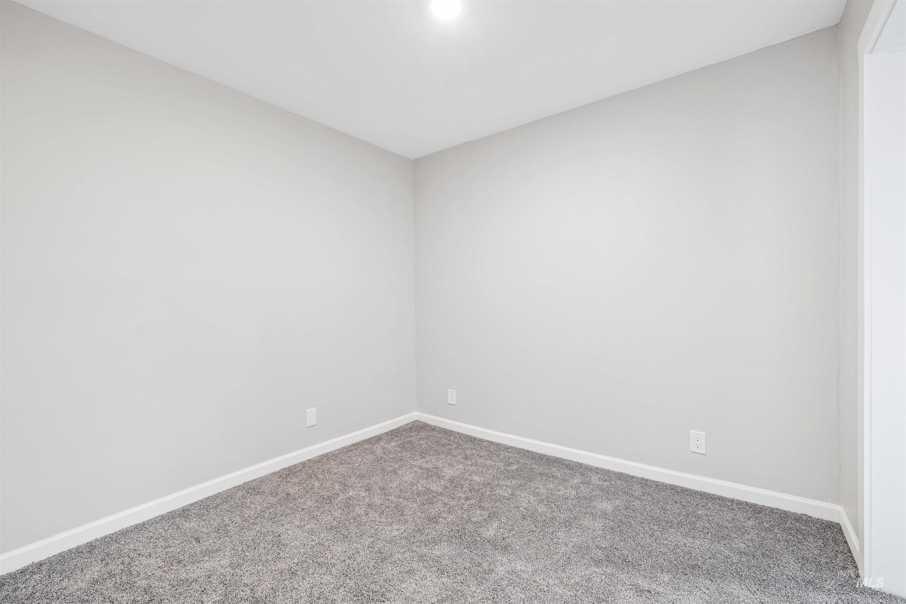 617 Eden Street North Twin Falls, ID 83301 - Photo 11 of 25 Unfurnished room featuring baseboards and carpet