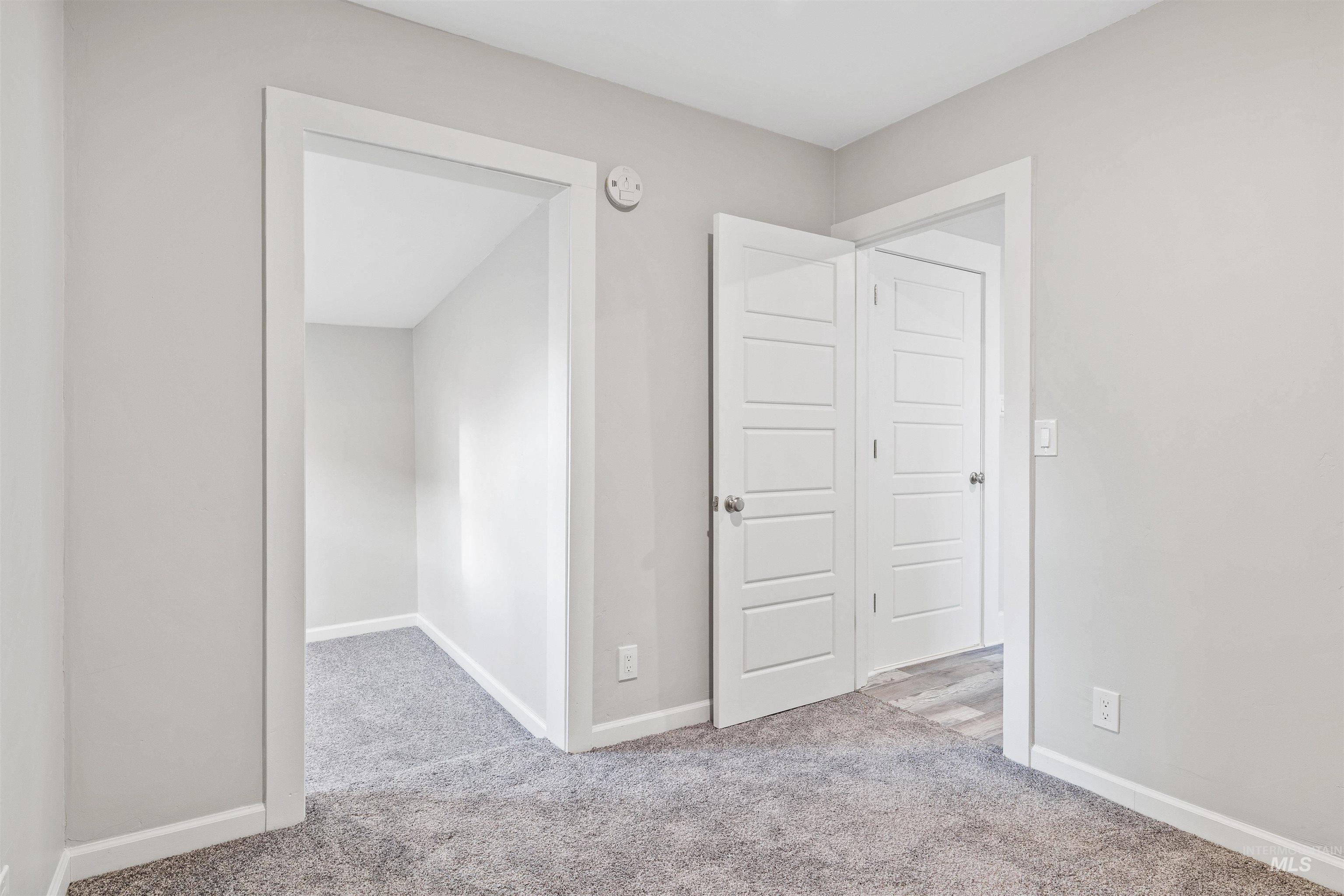 617 Eden Street North Twin Falls, ID 83301 - Photo 12 of 25 Unfurnished bedroom featuring light colored carpet and baseboards