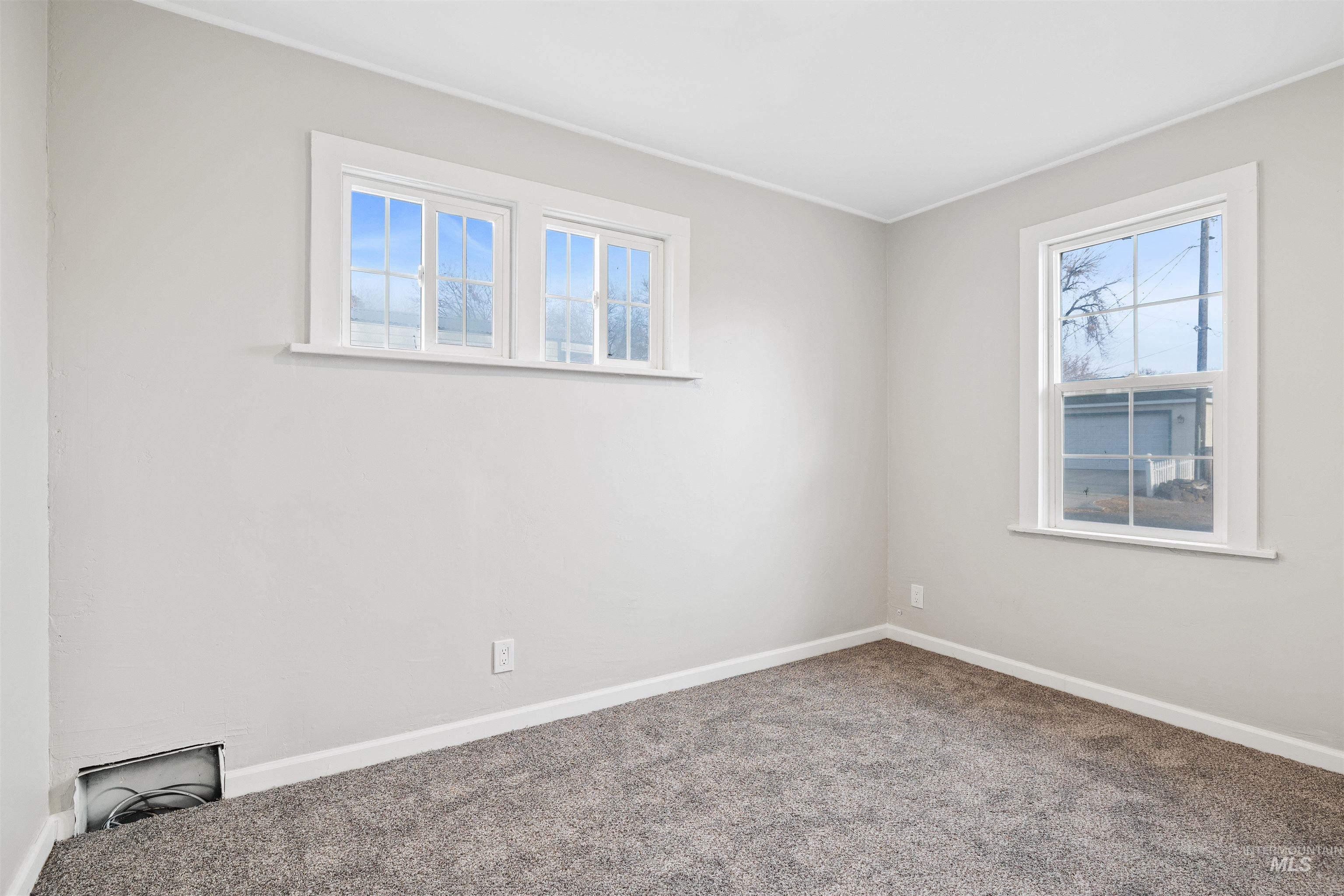 617 Eden Street North Twin Falls, ID 83301 - Photo 15 of 25 Empty room featuring baseboards and carpet floors