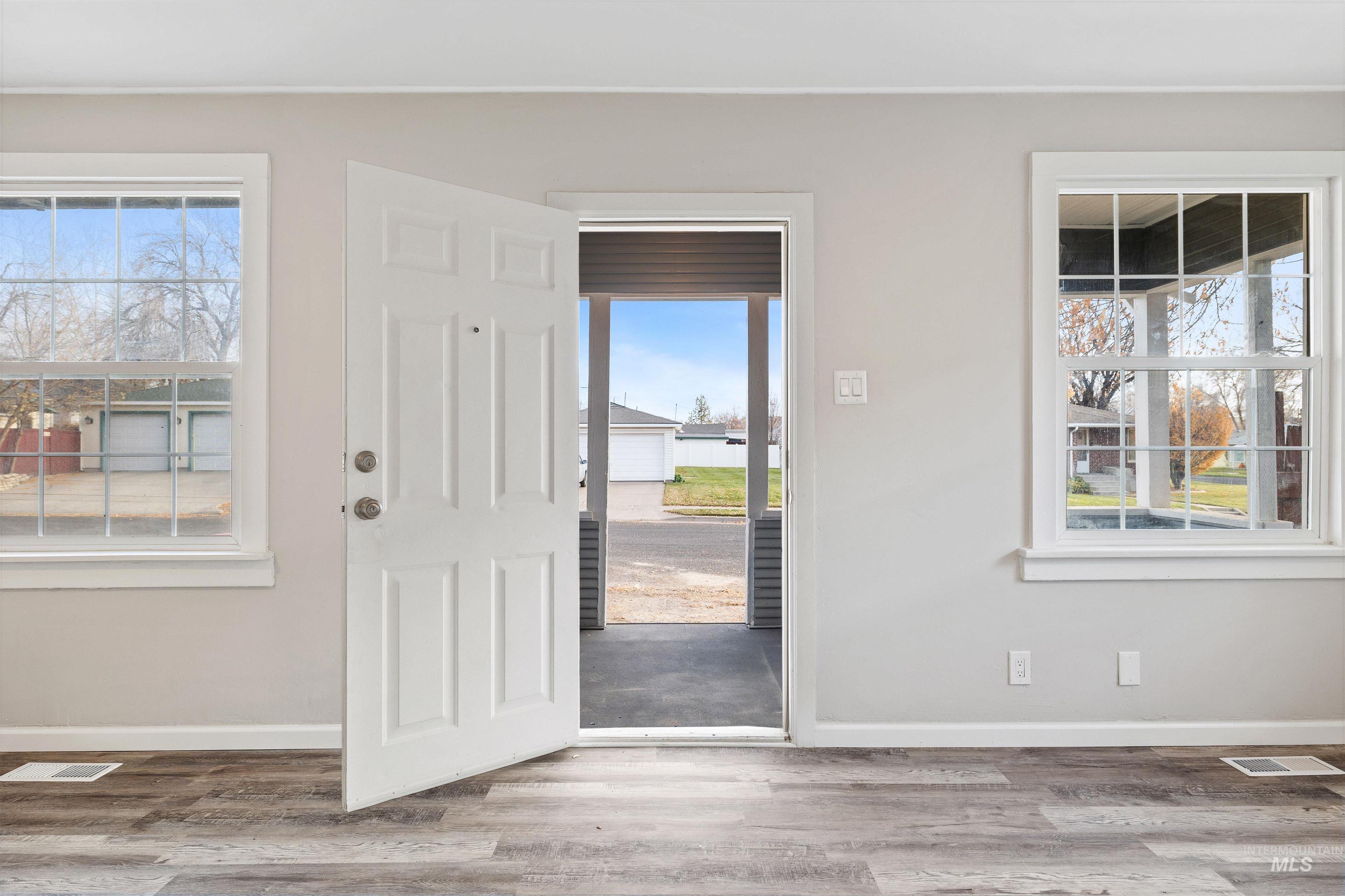 617 Eden Street North Twin Falls, ID 83301 - Photo 3 of 25 Entryway with healthy amount of natural light and light wood-type flooring