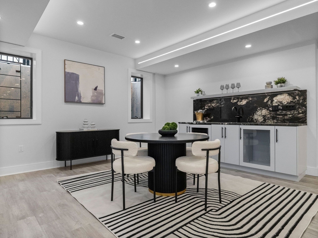 38 Kappius Path Newton, MA 02459 - Photo 6 of 13 a living room with furniture a table and kitchen view