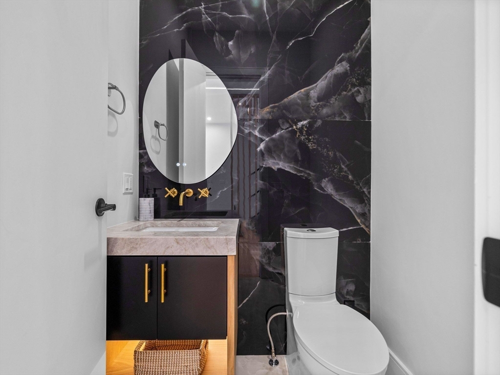 38 Kappius Path Newton, MA 02459 - Photo 8 of 13 a bathroom with a toilet mirror and vanity