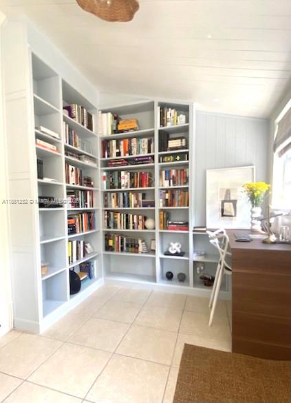 2952 Virginia Street Miami, FL 33133 - Photo 1 of 10 a living room with furniture and a book shelf
