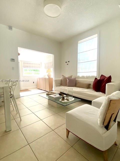 2952 Virginia Street Miami, FL 33133 - Photo 4 of 10 a living room with furniture and a table