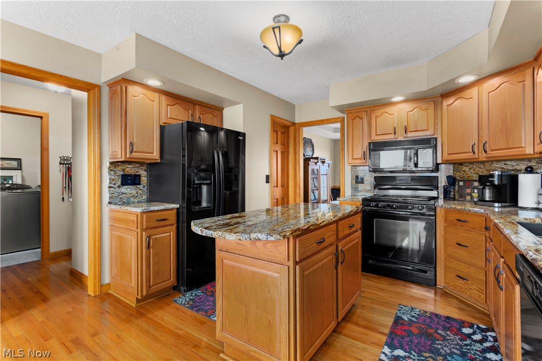 3503 Scheid Road Huron, OH 44839 - Photo 5 of 28 Kitchen View with Granite Counter, Island, Appliances Stay. Hardwood Floors