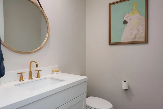a bathroom with a toilet and a sink