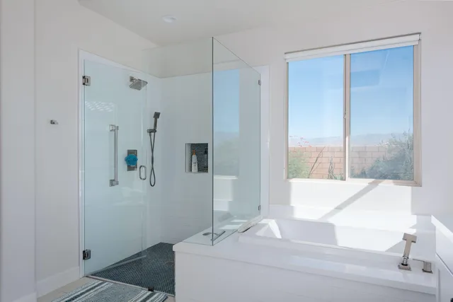 a bathroom with a bathtub and a shower