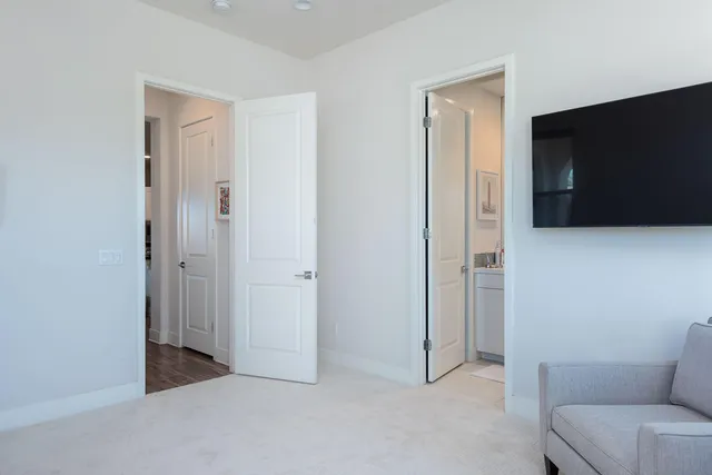 a view of a livingroom with furniture and a flat screen tv