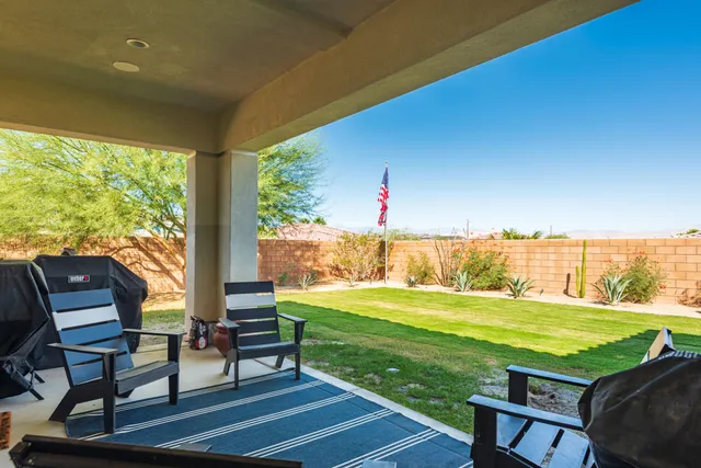 a view of a chairs and table on the terrace